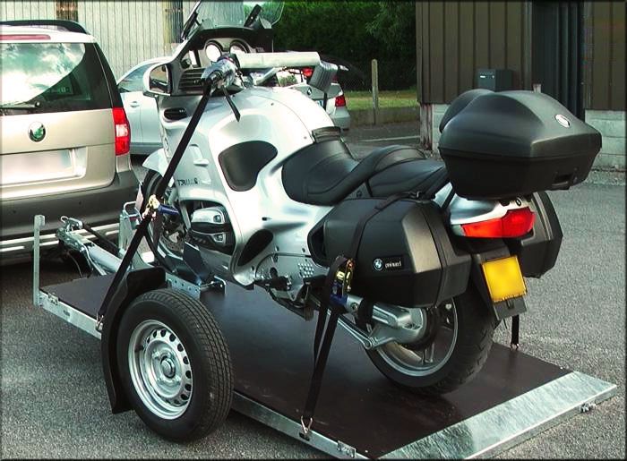 Motorbike transport by road on trailer